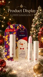 Detailed shot of KORMESIC Soothing Rose Lip Balm in festive Christmas theme packaging