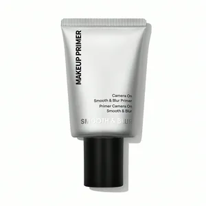 Detailed close-up of silver makeup primer tube for smooth and blurred skin texture.