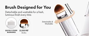 Detailed macro view of a color-changing foundation stick featuring a detachable brush