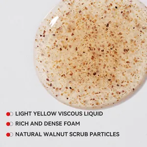 Close-up of men's exfoliating facial cleanser texture with walnut scrub particles.