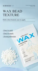 Close-up of white hair removal wax beads and packaging on a soft blue background.