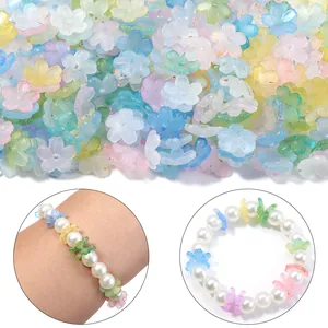 Close-up detail of colorful frosted 3D flower beads used in a handmade pearl bracelet design