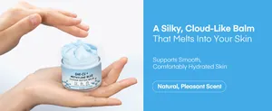 Close-up of blue copper peptide balm showing a silky cloud-like texture held in hands