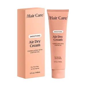 Professional smoothing air dry cream for hair with castor oil in stylish peach packaging