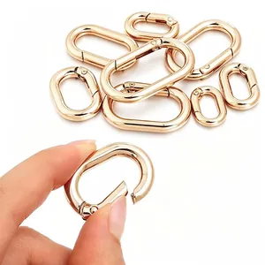 Macro detail of high-quality golden oval zinc alloy spring gate ring for bag accessories