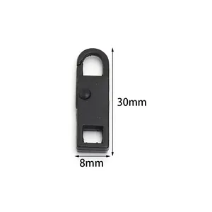Vue détaillée de la tirette de fermeture éclair en métal noir amovible, hauteur 30mm