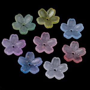 Detail showing multicolored frosted five-petal flower beads with elegant gold foil flakes.