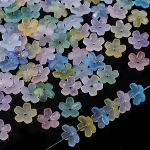 Macro view of frosted colorful five-petal flower beads with gold foil for DIY jewelry