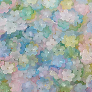 Close-up of pastel frosted five-petal flower spacer beads for DIY jewelry making