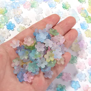 Detailed view of translucent pastel five-petal resin flower beads for DIY crafts