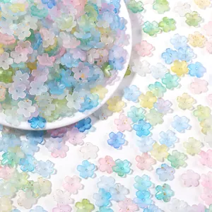 Close-up of frosted 3D five-petal flower beads with golden flecks for DIY jewelry making