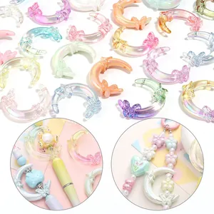 High-quality iridescent acrylic moon and butterfly charms for DIY jewelry making and crafts.
