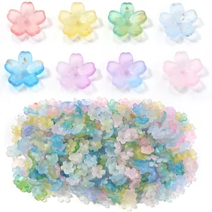 Close-up of frosted 3D flower beads in various pastel colors for jewelry making.