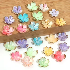 Detailed view of colorful gold-rimmed five-petal flower beads for DIY jewelry crafts