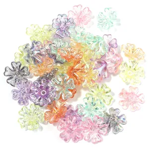 Detailed view of iridescent five-petal flower spacers for DIY jewelry making.