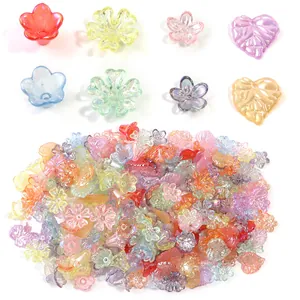 Detailed view of colorful iridescent flower and leaf shaped beads for DIY jewelry