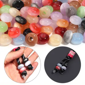 Detailed view of colorful cat-eye acrylic beads on braided cords for DIY jewelry crafts.