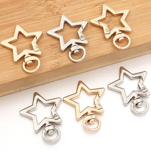 Detailed view of star-shaped zinc alloy spring clasps in gold and silver finishes