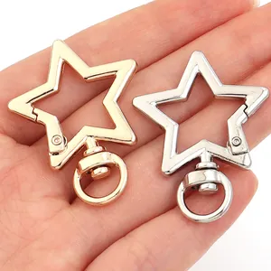 Detail of gold and silver star shaped zinc alloy lobster clasps for keychains