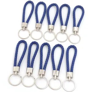 Set di dieci cordini in pelle intrecciata blu con portachiavi in metallo argento lucido