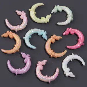 Colorful iridescent crescent moon charms with butterfly accents for DIY jewelry making