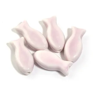 Adorable pink glazed ceramic fish shaped loose beads for DIY jewelry and necklaces