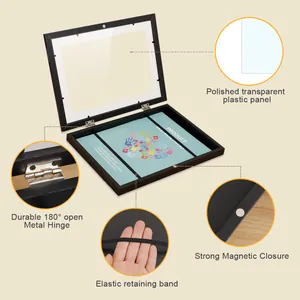 Details of children's art frame including hinges, magnetic closure, and plastic panel