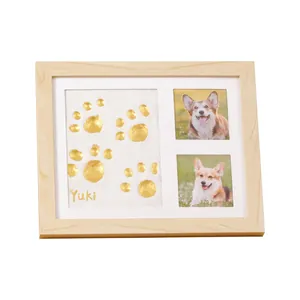 Custom wooden pet memorial photo frame with golden paw print clay and dog photos