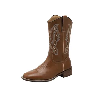 Vintage brown western cowboy boots with white embroidery and chunky mid-heel
