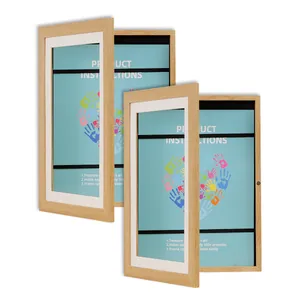 Detailed view of two open wooden A4 flip frames for children's art storage.