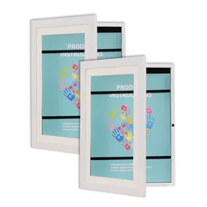 Detail view showing the white wooden A4 flip-open art frame with secure magnetic closure.