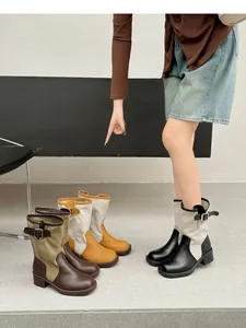 Collection of retro patchwork western boots in multiple colors with side buckle details