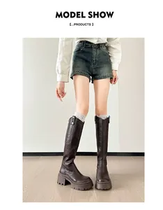 Detailed view of dark brown platform knee-high knight boots with chunky heels for women