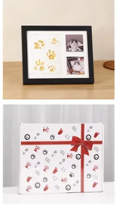 Detailed view showing a black pet commemorative photo frame and its decorative gift box packaging
