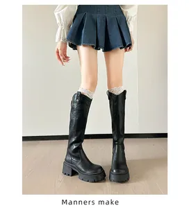 Detailed close-up showing black chunky platform knight boots with high heels on a model