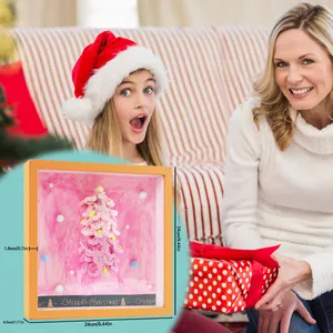 Detailed view of DIY pink Christmas tree shadow box ornament with clear dimensions.