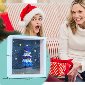 Detailed view of DIY Christmas tree shadow box with dimensions 24x24cm in festive room