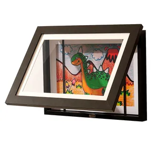 Side detail of a black front-opening kids art frame showing internal storage for drawings