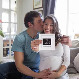 5-inch white wooden ultrasound picture frame for pregnancy baby keepsake on table