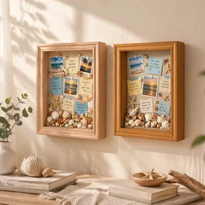 Vista detallada de marco vitrina 3D con conchas y fotos de estilo playero decorativo