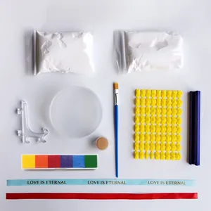 Complete pet memorial paw print kit including white clay, rainbow ink pad, and stamp set.