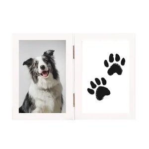 White wooden double folding pet memorial photo frame with paw print kit detail view