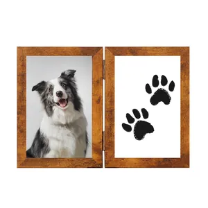 Handcrafted double hinged wooden pet memorial frame featuring dog photo and black paw prints