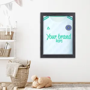 Detailed view of a black wooden jersey display frame mounted on a wall in a cozy room.