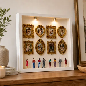 Detailed view of DIY mini museum shadow box with ornate gold frames and figures.