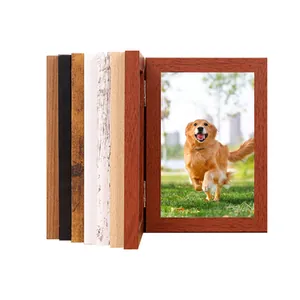 Close-up of a hinged wooden pet memorial photo frame with multiple wood color options