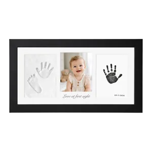 Keepsake baby handprint and footprint frame set with photo and clay cast