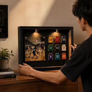 Detailed view of a basketball jersey pin display box with LED spotlights.