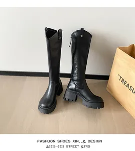 Detailed view of stylish black tall knight boots with 7.5cm chunky platform heels