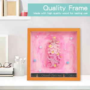 Detailed close-up of the DIY pink Christmas tree shadow box with orange wooden frame
